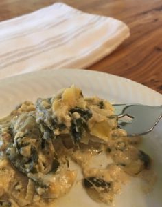 Spinach-artichoke casserole on plate