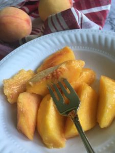 Peaches sliced with fork