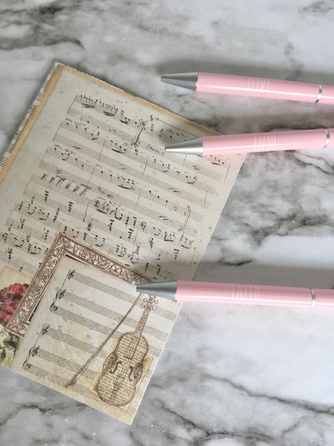 Pink pens, music notes