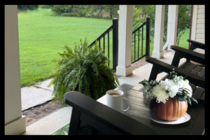 GFP PORCH with black rockers and Pumpkin with flowers