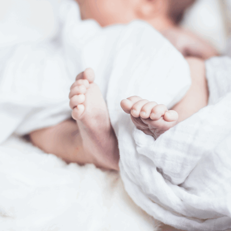 Cozy bedding with baby feet